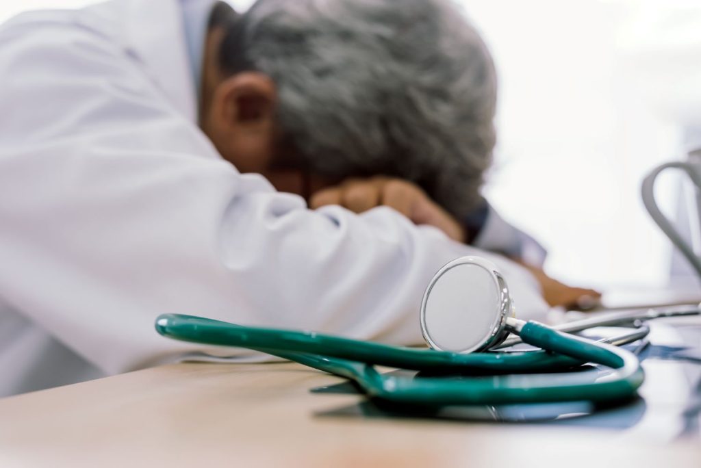 Senior doctor overwork Tired physician burnout