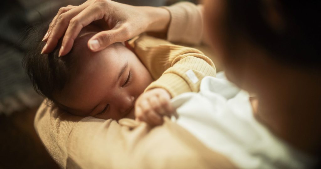 Asian Baby breastFeeding from Mother. Infant, newborn breast milk, obgyn photo