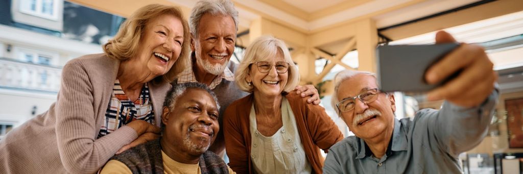 Happy seniors taking selfie at retirement community. Elderly, nursing home, assisted living, photo