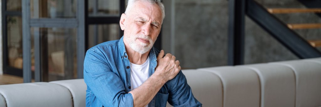 Senior man suffering from pain in shoulder, RA, rheumatoid arthritis, joint pain, rheumatology, photo