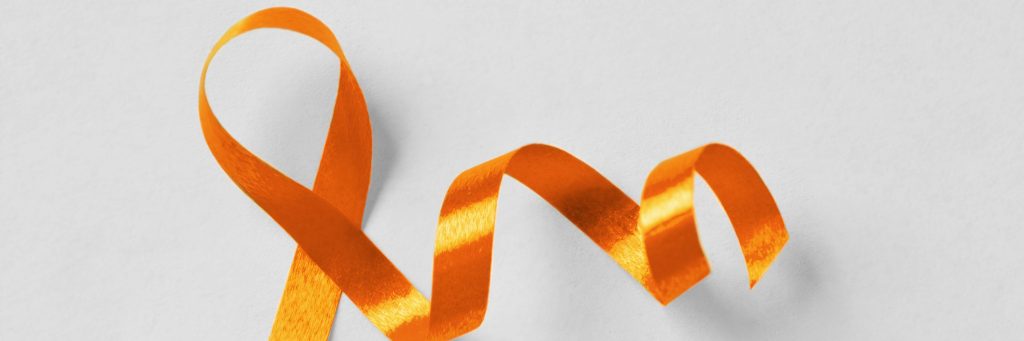 orange ribbon on gray background, leukemia, multiple scleroris awareness, photo
