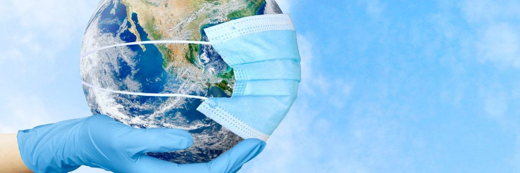 The doctor's hands are holding the planet Earth in a medical mask. The concept of society, responsibility. Global. Coronavirus. An epidemic. World Health Association. Image elements provided by NASA.