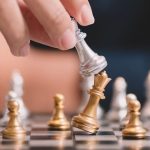The competition challenge of business by chessboard. solution strategy game concept. Decision by leadership battle of intelligence and management for team success. Opportunity of move to the winner.