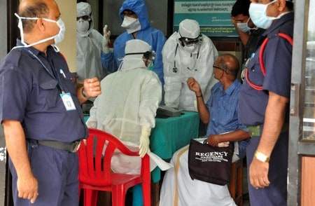 Ten die in India outbreak of brain-damaging virus, spurring rush to hospitals