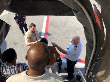 Eleven aboard flight from Dubai hospitalized in apparent flu outbreak