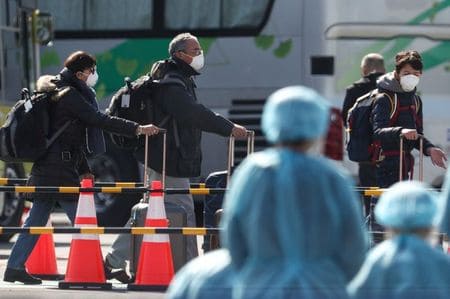 Japan govt faces questions over coronavirus, Tokyo cancels events