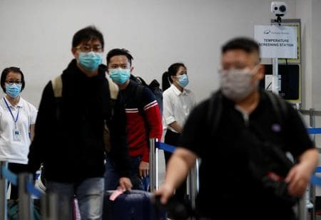 Singapore charges visitors for coronavirus treatment after imported Indonesian cases