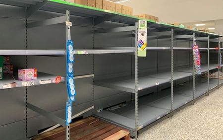 Soccer suspended and shoppers fill trolleys as coronavirus bites in Britain