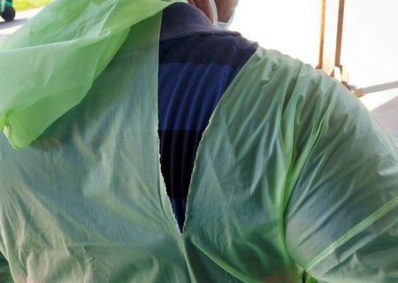 Indian doctors fight coronavirus with raincoats, helmets amid lack of equipment