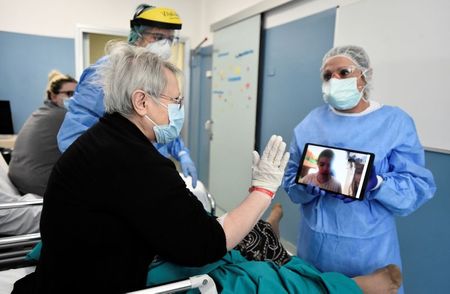 Coronavirus patients, families exchange virtual kisses in Italy hospital