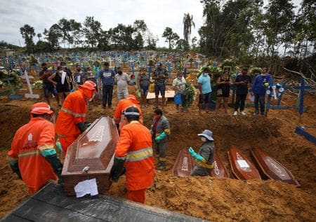 Amazon city resorts to mass graves as Brazil COVID-19 deaths soar