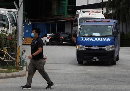 Singapore reports 1,016 more coronavirus cases, 12th death