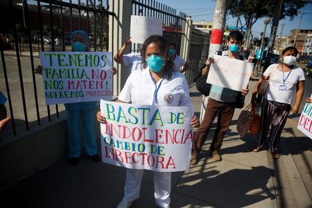 Masks reused and bodies mount as Peru strains under coronavirus