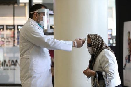 Iran’s coronavirus toll rises, but holding steady at under 100 new deaths per day