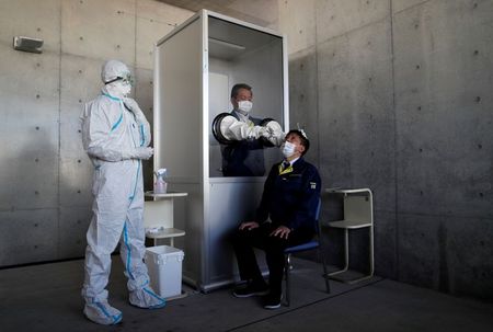 Tokyo launches coronavirus drive-through tests as crisis deepens